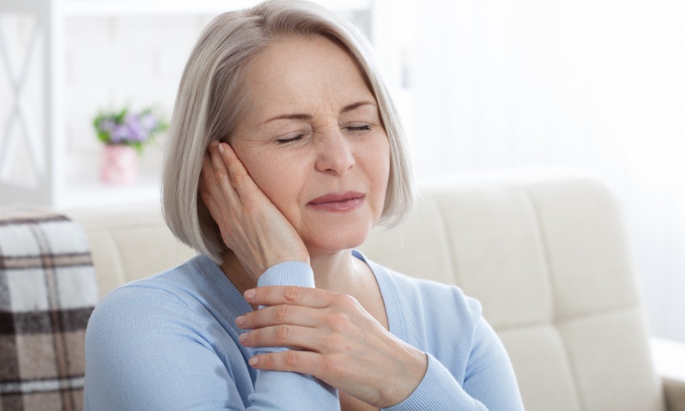 a woman suffering from tinnitus